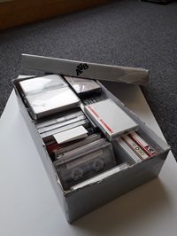 Cassette tapes of oral heritage recordings in a shoebox