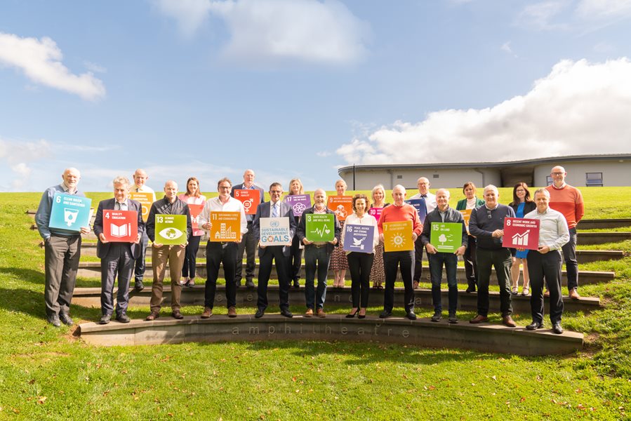 Picture showing senior management members of mayo county council holding placards outlining each of the sustainable development goals